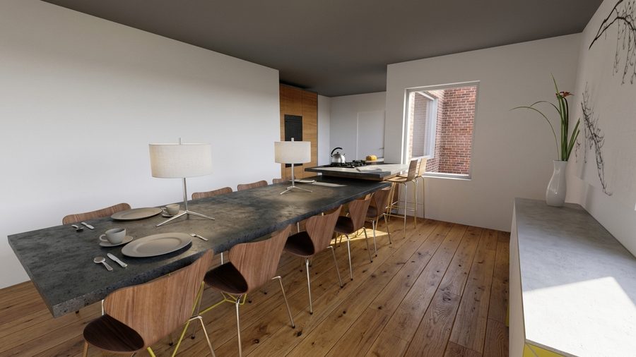De eetkamer met een lange tafel, aansluitend op de keuken