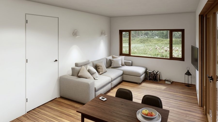 Het interieur met de zithoek aan de puizijde en bergruimte langs de gesloten wand