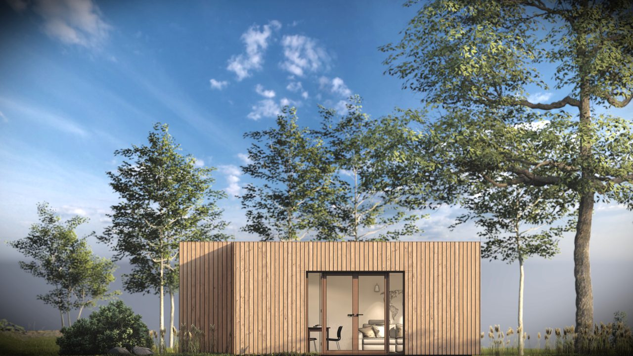 Gevelaanzicht van de recreatiewoning tussen de bomen