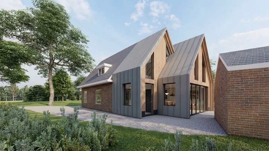 De uitbouw vanaf de tuin, met de bestaande bakstenen woning ernaast