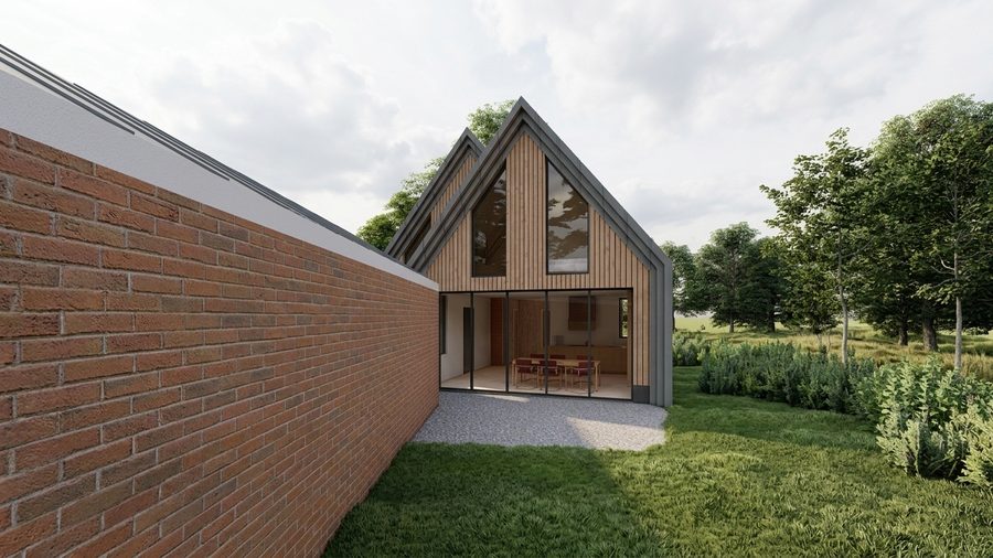De overdekte ruimte tussen de bestaande bakstenen muur en het nieuwe volume