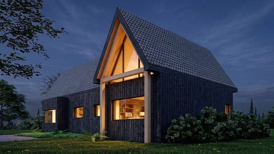 De aanbouw bij avond, met de glazen topgevel die van binnenuit oplicht