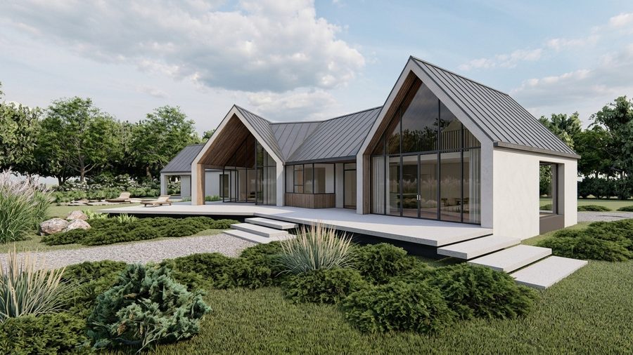 Kopgevel van de woning met wit stucwerk en grote glazen openingen
