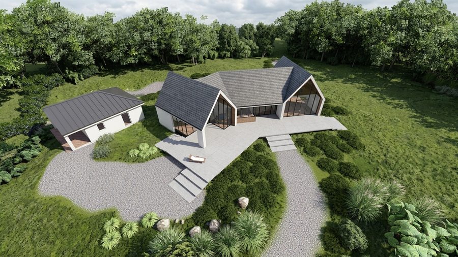 De woning van bovenaf gezien, met de twee kappen en het bijgebouw op het perceel